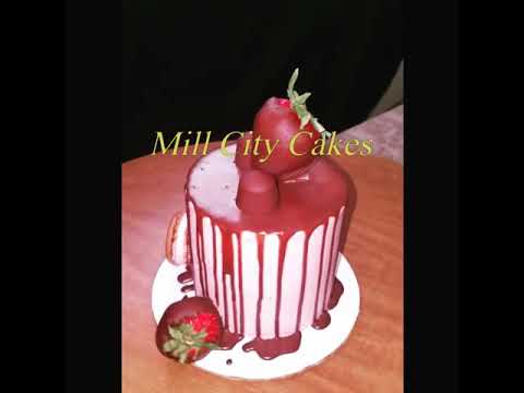 Chocolate  drip cake w/ Strawberry buttercream w/ fresh strawberries in both layers