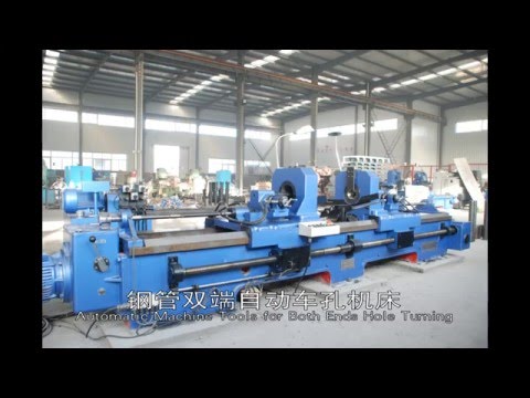 Double end boring machine for idler rollers