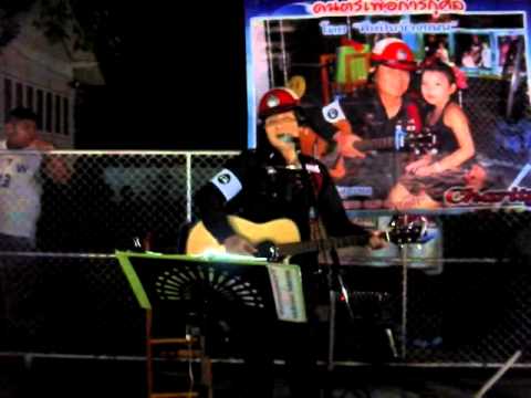 Chiang Mai police officer sing at Sunday Night Market.