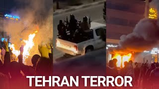 Iranian state armed militias fire heavy weapons as protests continue to erupt in Tehran
