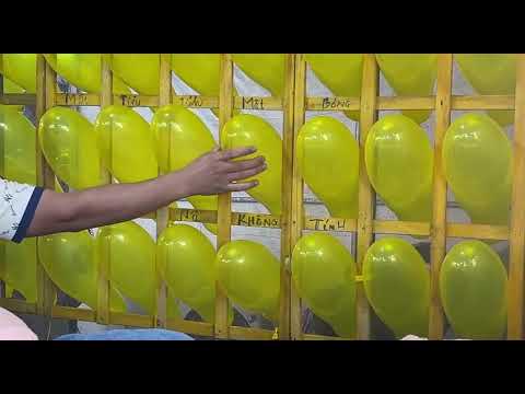 Playing the ball toss game to win stuffed animals is super fun