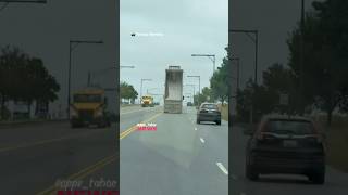 Dump truck with its bed raised strikes traffic signal Fredrick Maryland
