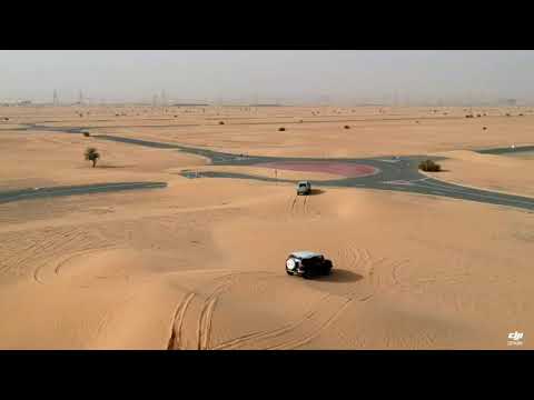 A small offroad in galloper 2001 and toyota FJ cruiser  at Dubai's half desert road