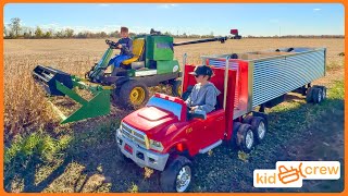 Miniature kids combine harvesting soybeans on farm with semi truck. Educational | Kid Crew