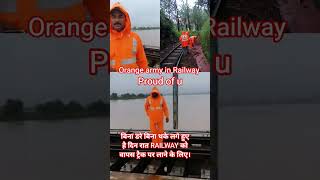 RAILWAY KI ORANGE ARMY 💪 #railway #gangman #flood #indianrailways #railtrack #shorts #viral #youtube