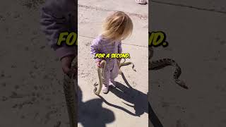 Toddler Caught Dual-Wielding Live Snakes Like a Boss