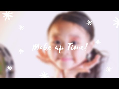Make up time using “Claire’s Rainbow Glitter Cat Make up Book”