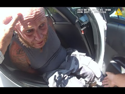 Man Having Panic Attack, Stuffed In Back Of Police Car.