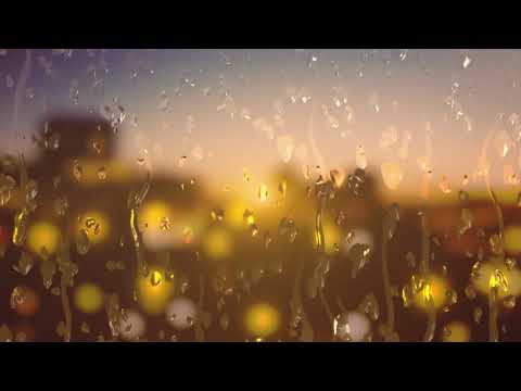 Water Droplets Sliding Down A Glass Window