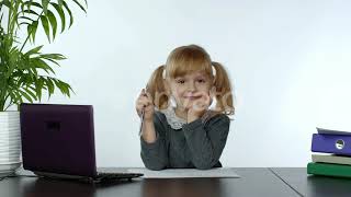 Preschool Child Girl Distance Online Learning at Home. Kid Studying Using Digital Laptop Compute...