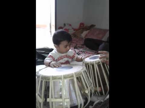 8 month boy playing tabla