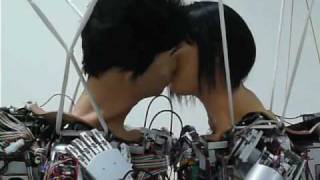 Humanoid robots Thomas and Janet rehearse kiss scene