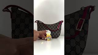Discover Pre-Loved Luxury: GUCCI Monogram Pochette in Black Red - Now at HivePreloved.com !