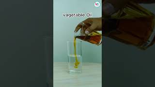 Ice cube floating on water inside vegetable oil #scienceexperiment #experiment #physics