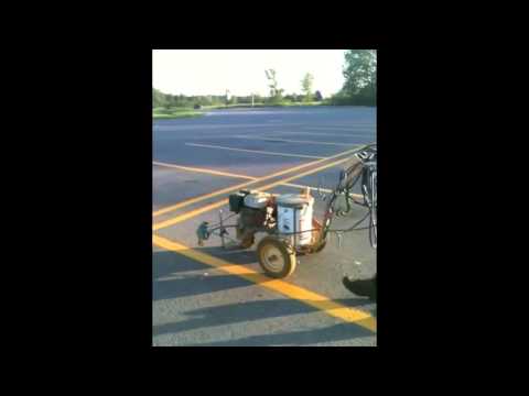 Plusworld Roofing: Graco Line Lazer Line Painting Equipment Sprayer on Large Parking Lot
