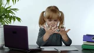 Preschool Child Girl Distance Online Learning at Home. Kid Studying Using Digital Laptop Compute...