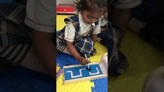 Pattern writing activity for nursery class students