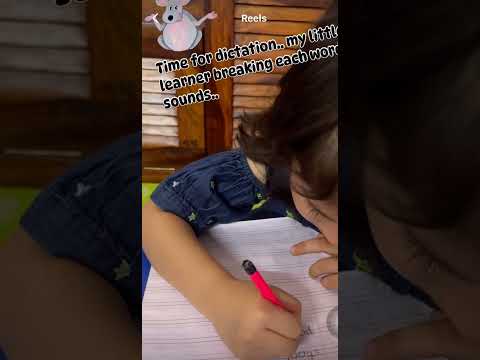 Segmenting each word into sounds to spell them