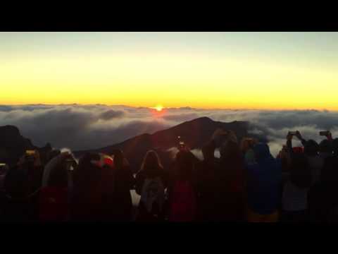 HALEAKELA NATIONAL PARK AND THE SUNRISE ATOP HALEAKALA VOLCANO IN MAUI HAWAII.