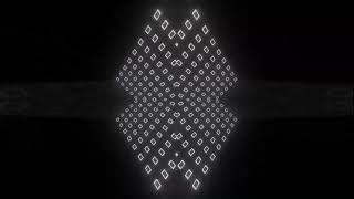 black and white revolving walls with light boxes in a prism