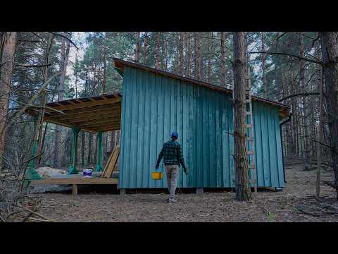 Off Grid Cabin building in the woods, Cut down trees, Painting the house, Rainy day