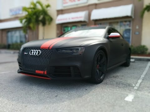 Audi RS 5 wrapped in 3M matte black with matte red stripes by Florida Car Wrap