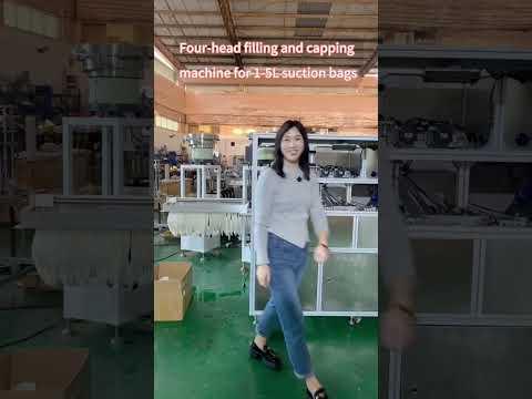 Automatic four head filling and capping machine for 1 5L suction bags