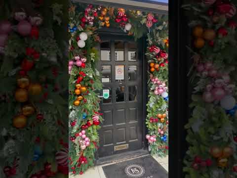 Christmas doorway installation #flowers #floraldesign #christmas #christmasdecor
