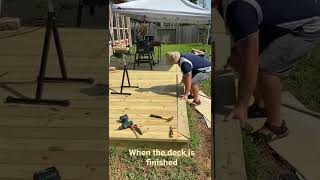 16x24 wood deck install last piece 2x6 on ground level with Simpson connections under deck