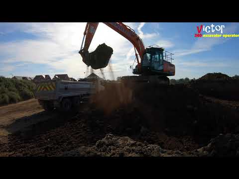 Hitachi ZAXIS 210LC Excavator loading a tipper truck