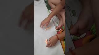 Teaching Abhigya to make letter "A" from clay-Activity based learning
