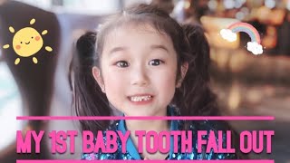 My first baby tooth fall out and the Tooth Fairy is here!