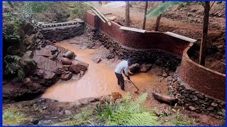 The man built a beautiful fish pond in the bamboo forest