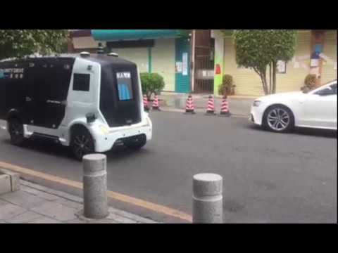 A Worker Collecting Goods from the Unity-Drive Autonomous Vehicle During the Epidemic of COVID-19
