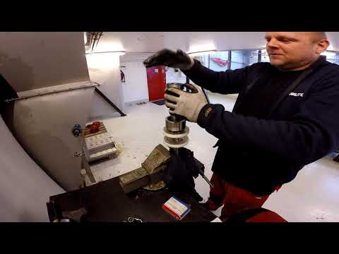 Replacing bearing on scraper idle shaft on the MudCube