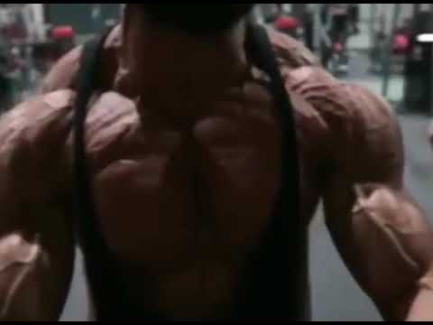 Bodybuilder Neil Currey flexes his pectorals